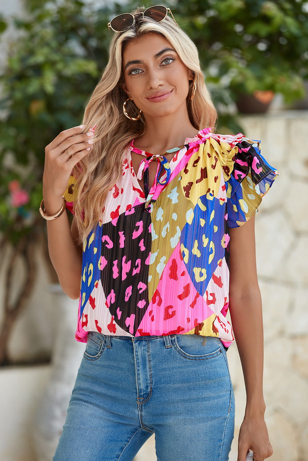 Multicolour Leopard Flutter Sleeve V Neck Crinkled BlouseMaterial:100%Polyester

• Stand out in style with this blouse, perfect for adding a touch of wild elegance to your wardrobe.
• The vibrant multicolored leopard pri