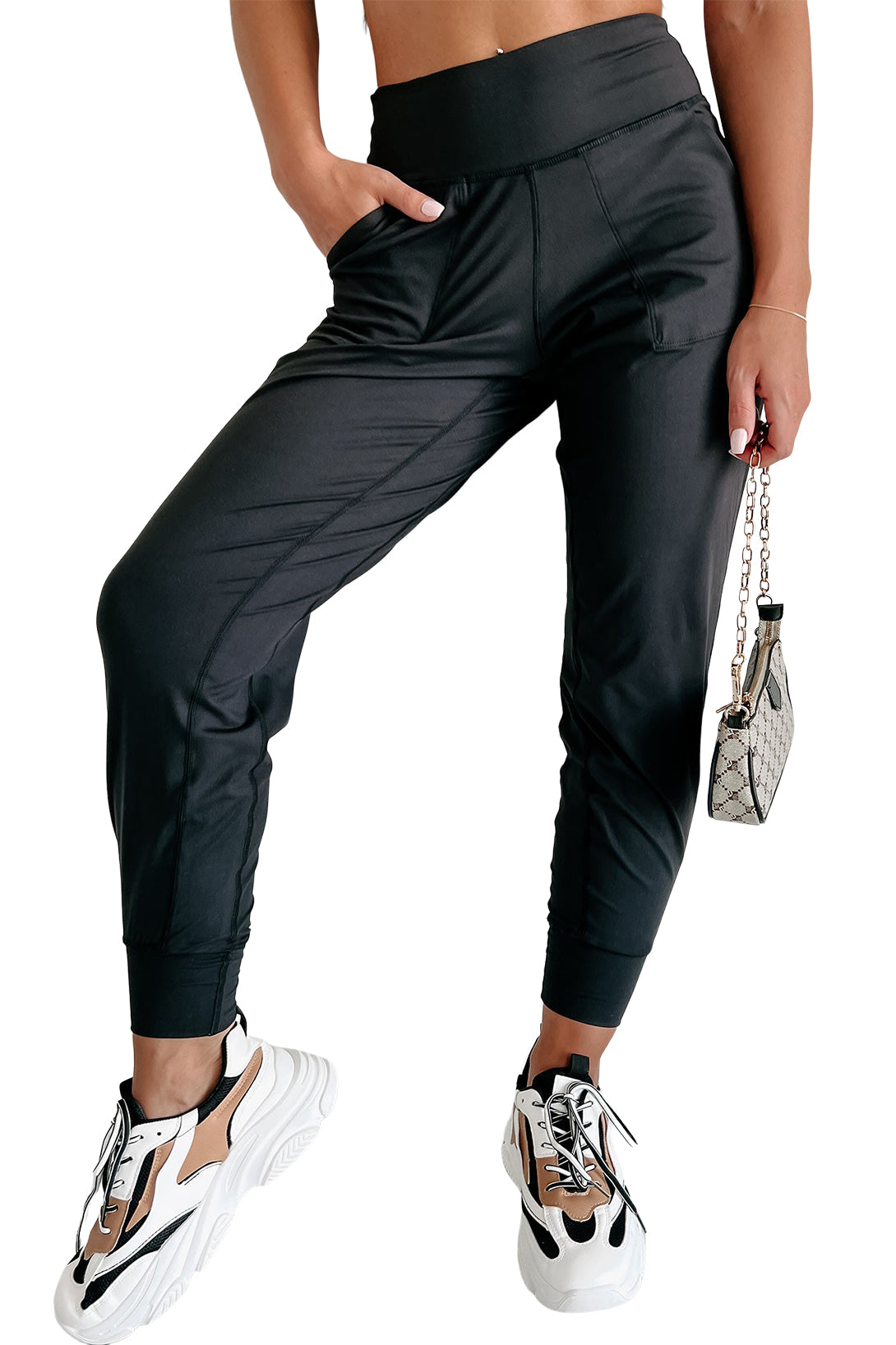 Black Exposed Seam High Waist Pocketed JoggersMaterial:100%Polyester



		These solid joggers are a versatile addition to your wardrobe, suitable for individuals of all body types.

	
		The exposed seam desi