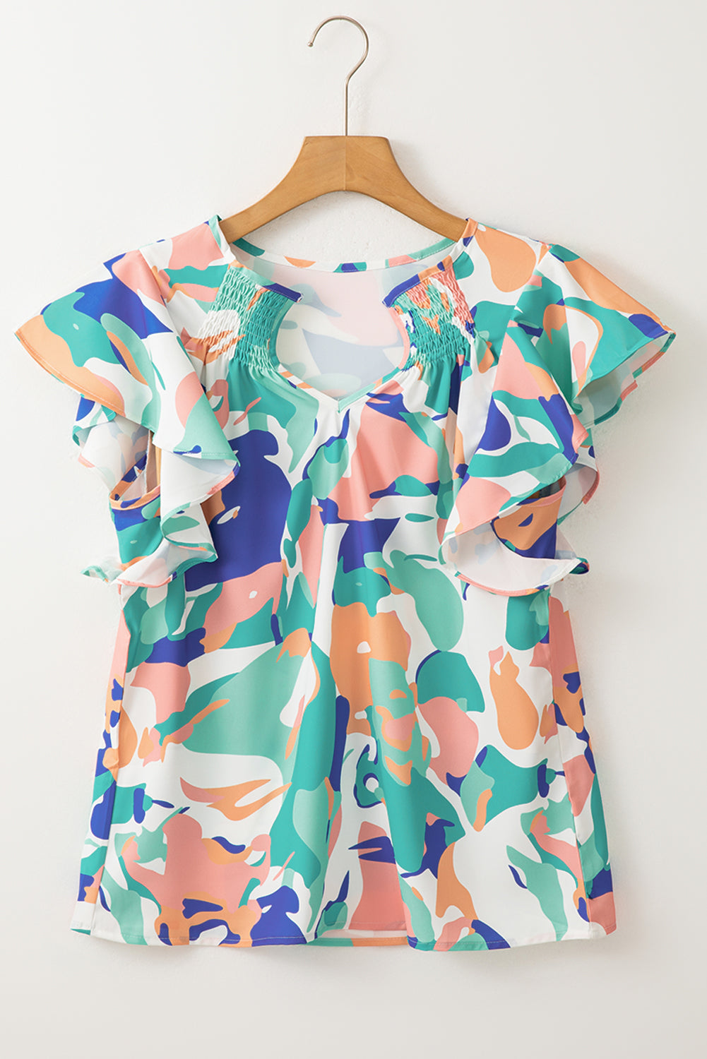 Green Abstract Print Smocked Notched Neck Ruffle Sleeve BlouseMaterial:100%Polyester

• Embrace a bohemian spirit with the blouse, featuring a vibrant green hue that adds a pop of color to any outfit.
• The abstract print des