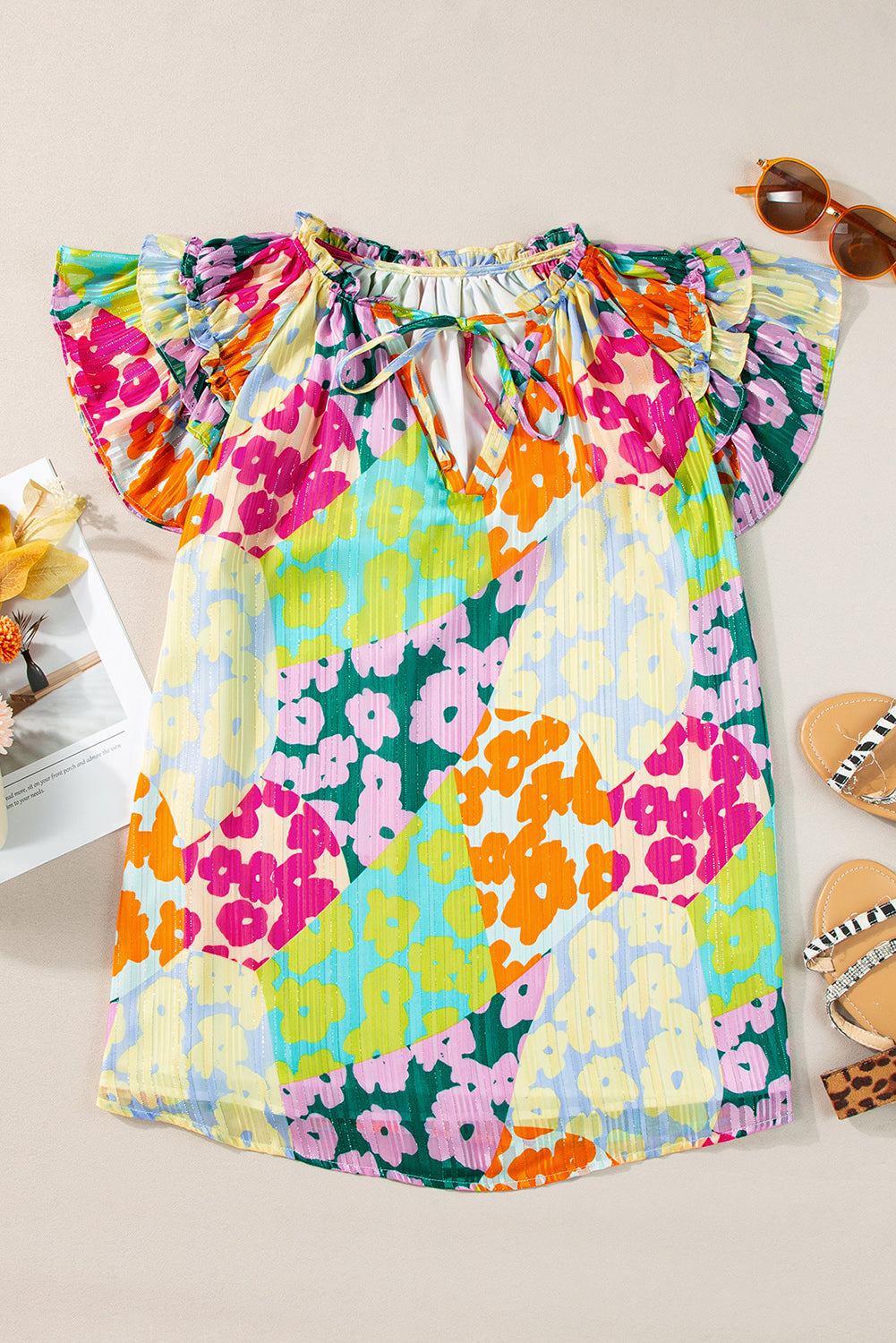 Multicolour Leopard Flutter Sleeve V Neck Crinkled BlouseMaterial:100%Polyester

• Stand out in style with this blouse, perfect for adding a touch of wild elegance to your wardrobe.
• The vibrant multicolored leopard pri
