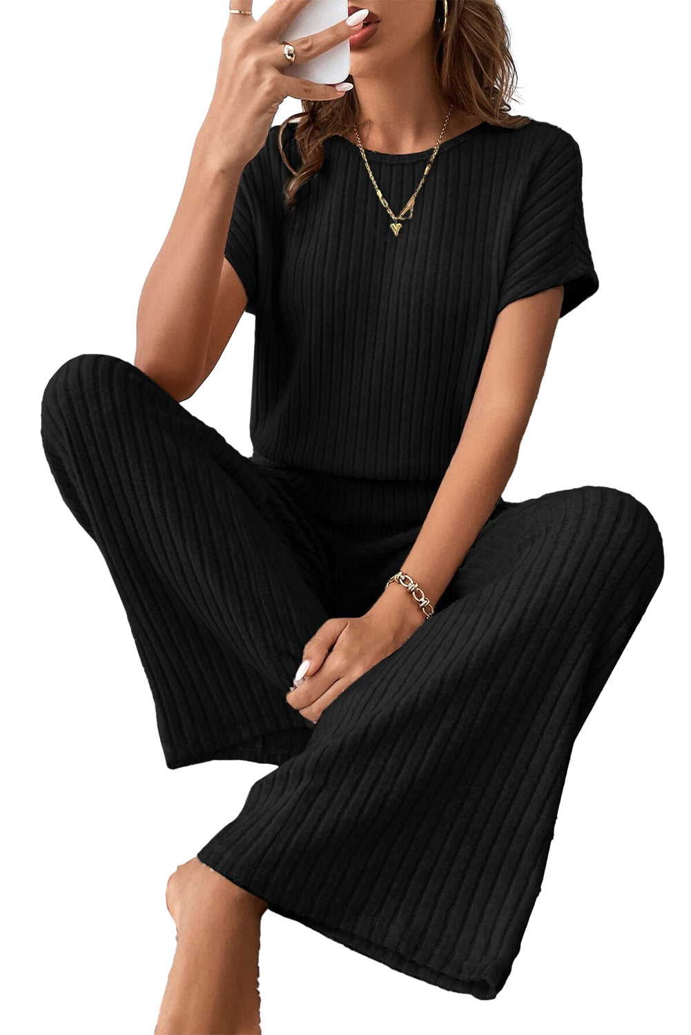 Grass Green Solid Color Ribbed Short Sleeve Wide Leg JumpsuitMaterial:85%Polyester+10%Viscose+5%Elastane



		The jumpsuit is a versatile and trendy one-piece outfit, featuring a solid color design that offers a sleek and mi