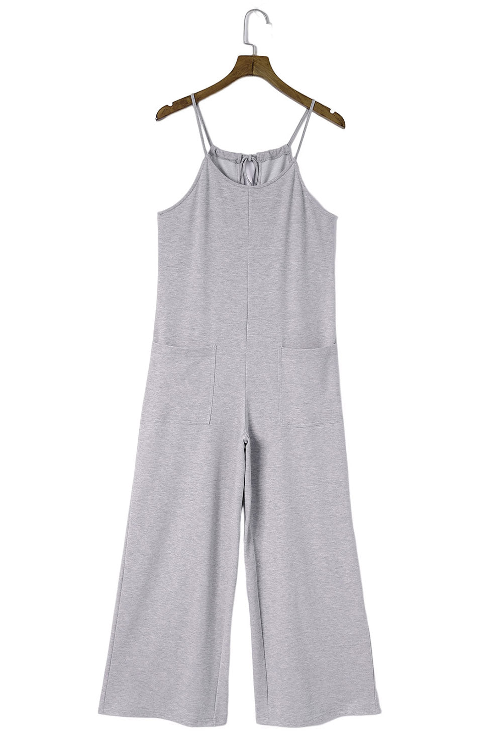 Gray Loose Fit Side Pockets Spaghetti Strap Wide Leg JumpsuitMaterial:65%Polyester+30%Cotton+5%Elastane



		Featuring a loose fit, the wide leg
jumpsuit provides freedom of movement
	
	
		Spaghetti straps highlight wome