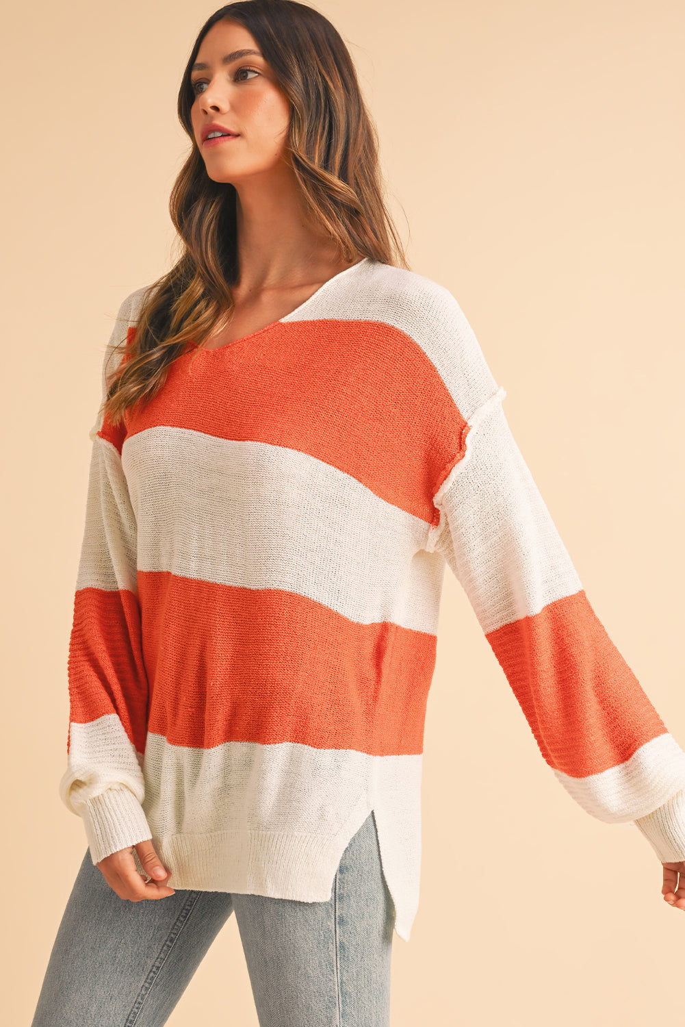 Orange Colorblock V Neck Side Slits SweaterMaterial:100%Acrylic

• Stand out in style with our sweater, blending casual stripes with a trendy rib-knit design.
• The vibrant orange hues add a pop of color to