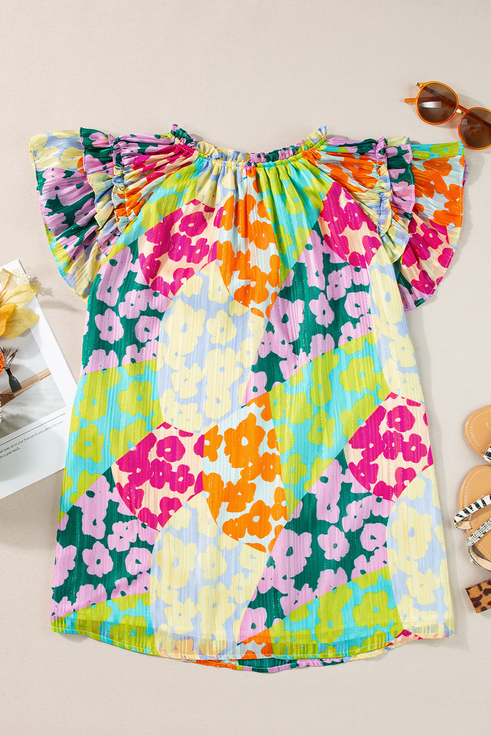 Multicolour Leopard Flutter Sleeve V Neck Crinkled BlouseMaterial:100%Polyester

• Stand out in style with this blouse, perfect for adding a touch of wild elegance to your wardrobe.
• The vibrant multicolored leopard pri