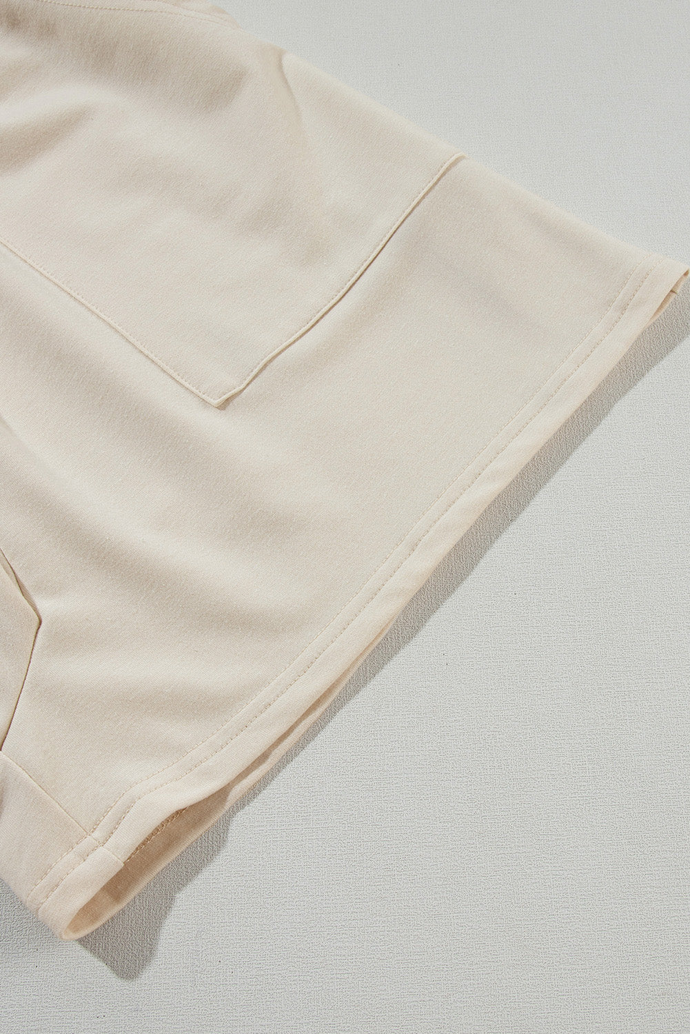 Beige Solid Color Buttons Smocked Sleeveless RomperMaterial:85%Polyester+10%Cotton+5%Elastane

• Its high waist design adds a flattering touch to any silhouette.
• Embrace the versatility of this romper with its sl