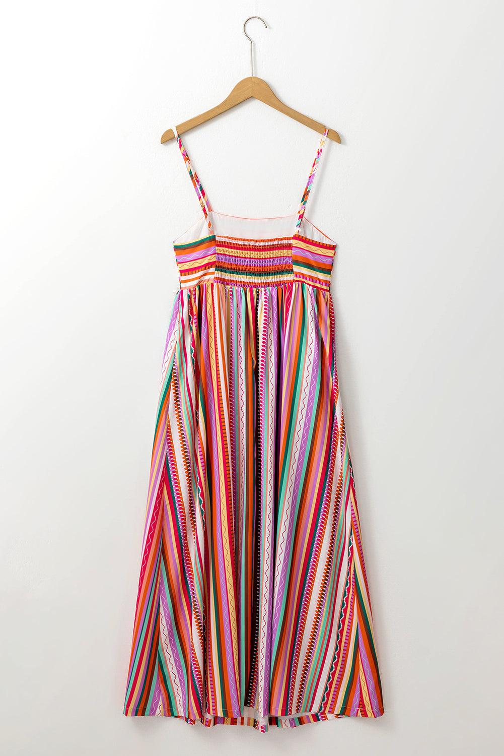 Multicolour Boho Striped Spaghetti Strap Smocked Back Maxi DressMaterial:100%Polyester

• Embrace a vibrant blend of colors in this maxi dress, perfect for daily wear with its relaxed, sleeveless design.
• The shirred back ensu