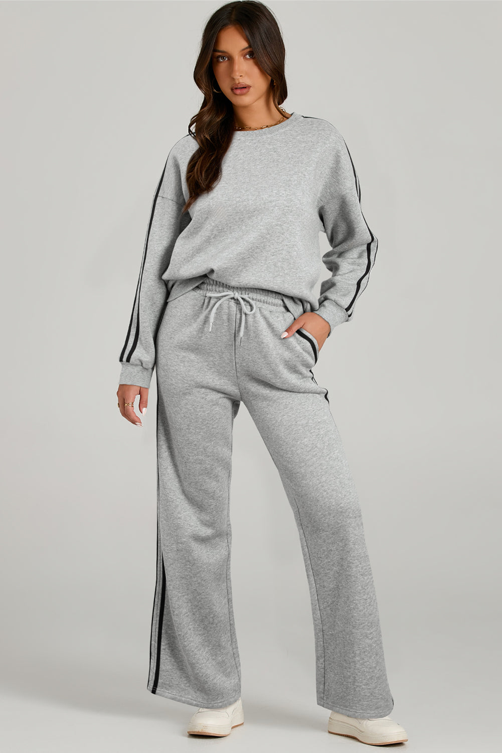 Light Grey Solid Color Side Striped Sweatshirt Pants SetMaterial:50%Polyester+50%Cotton

• This pants set exudes a modern appeal perfect for casual outings or lounging at home.
• Crafted from high-quality fabric for a s