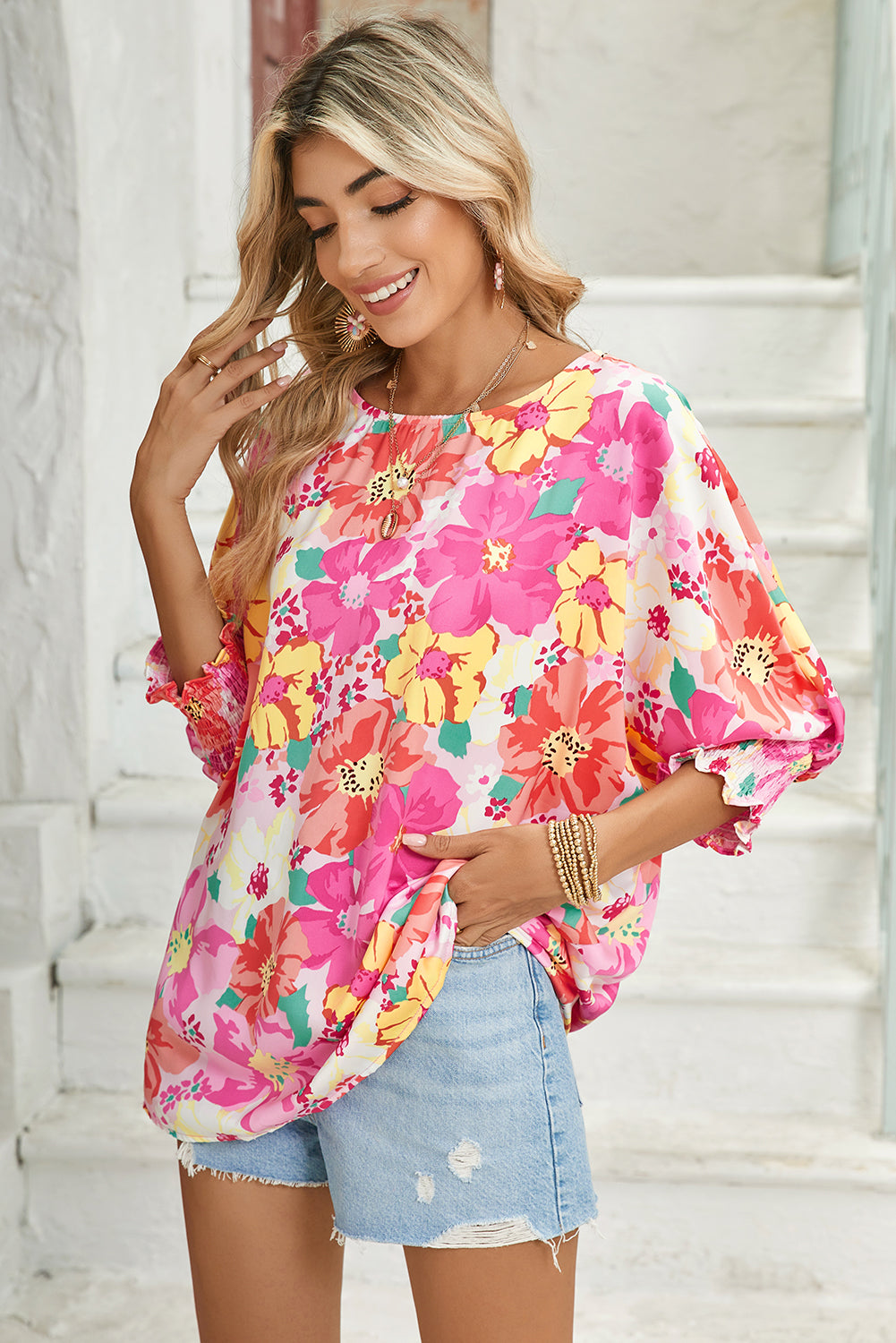 Pink Shirred Cuffs 3/4 Sleeve Boho Floral BlouseMaterial:100%Polyester



		The blouse is a stylish and feminine top featuring shirred cuffs and a boho-inspired floral print, adding a touch of bohemian charm to 
