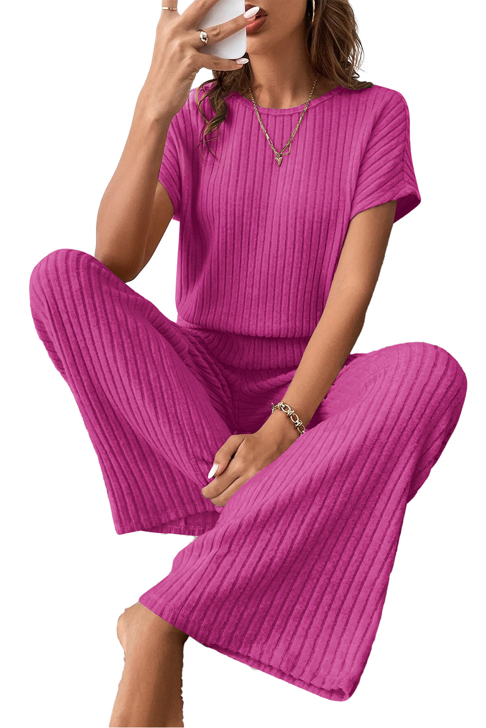 Grass Green Solid Color Ribbed Short Sleeve Wide Leg JumpsuitMaterial:85%Polyester+10%Viscose+5%Elastane



		The jumpsuit is a versatile and trendy one-piece outfit, featuring a solid color design that offers a sleek and mi