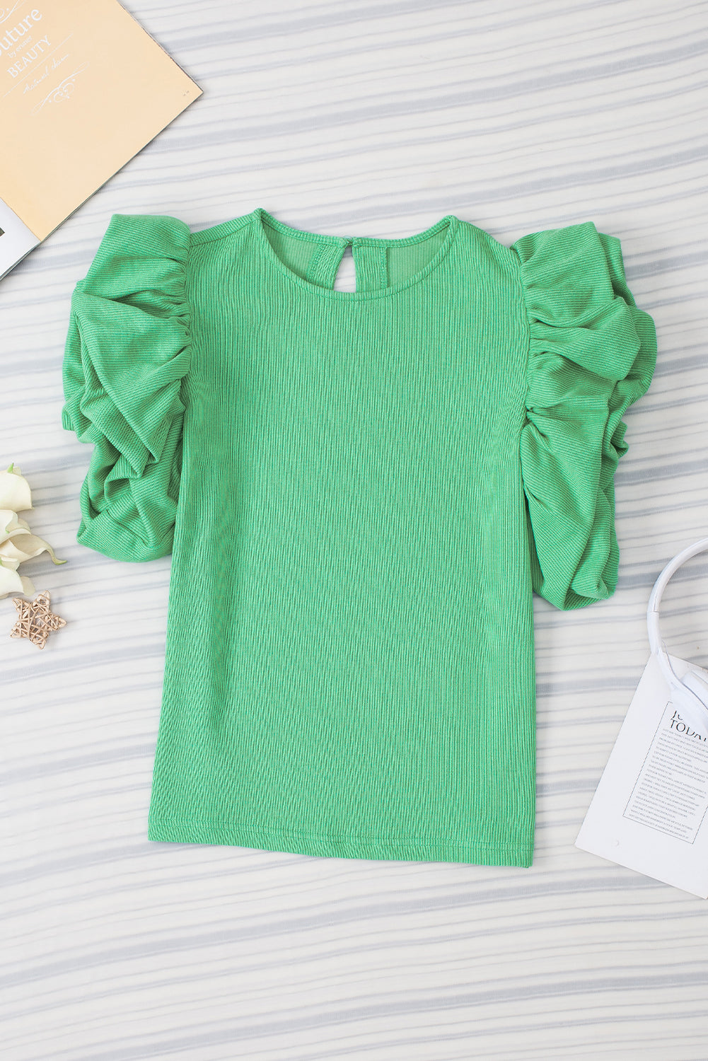 Green Solid Color Ruffle Sleeve Ribbed BlouseMaterial:65%cotton+33%polyester+2%Elastane



		The blouse features ruffle sleeves, which add a playful and romantic touch to the overall design. 
	
	
		The sol