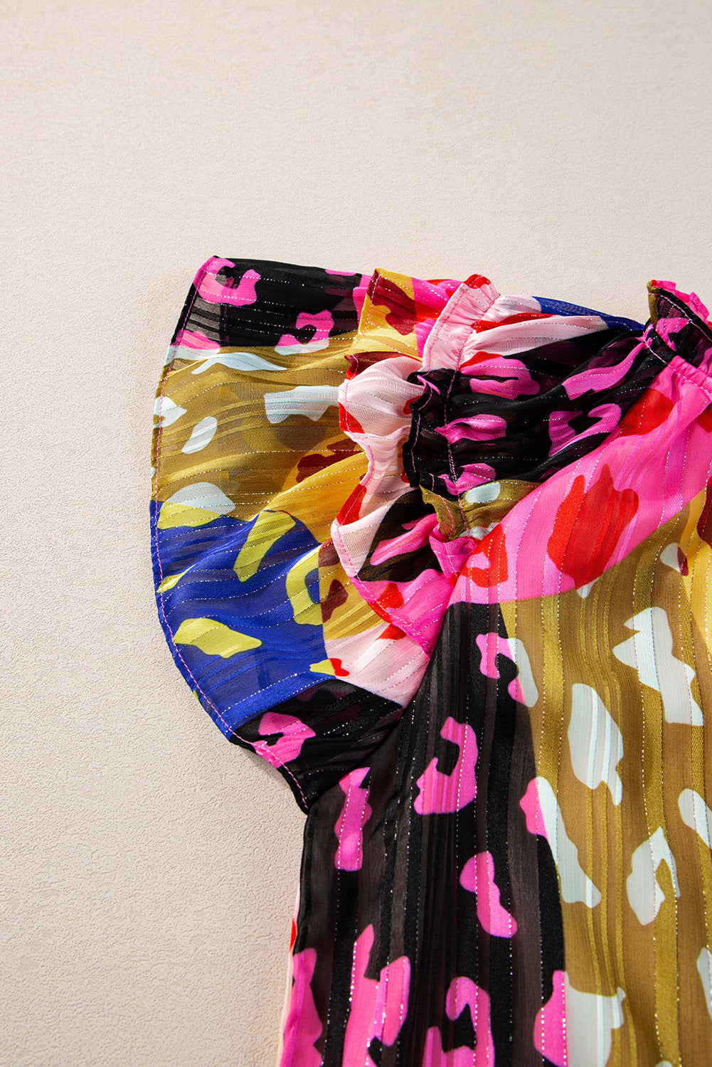 Multicolour Leopard Flutter Sleeve V Neck Crinkled BlouseMaterial:100%Polyester

• Stand out in style with this blouse, perfect for adding a touch of wild elegance to your wardrobe.
• The vibrant multicolored leopard pri