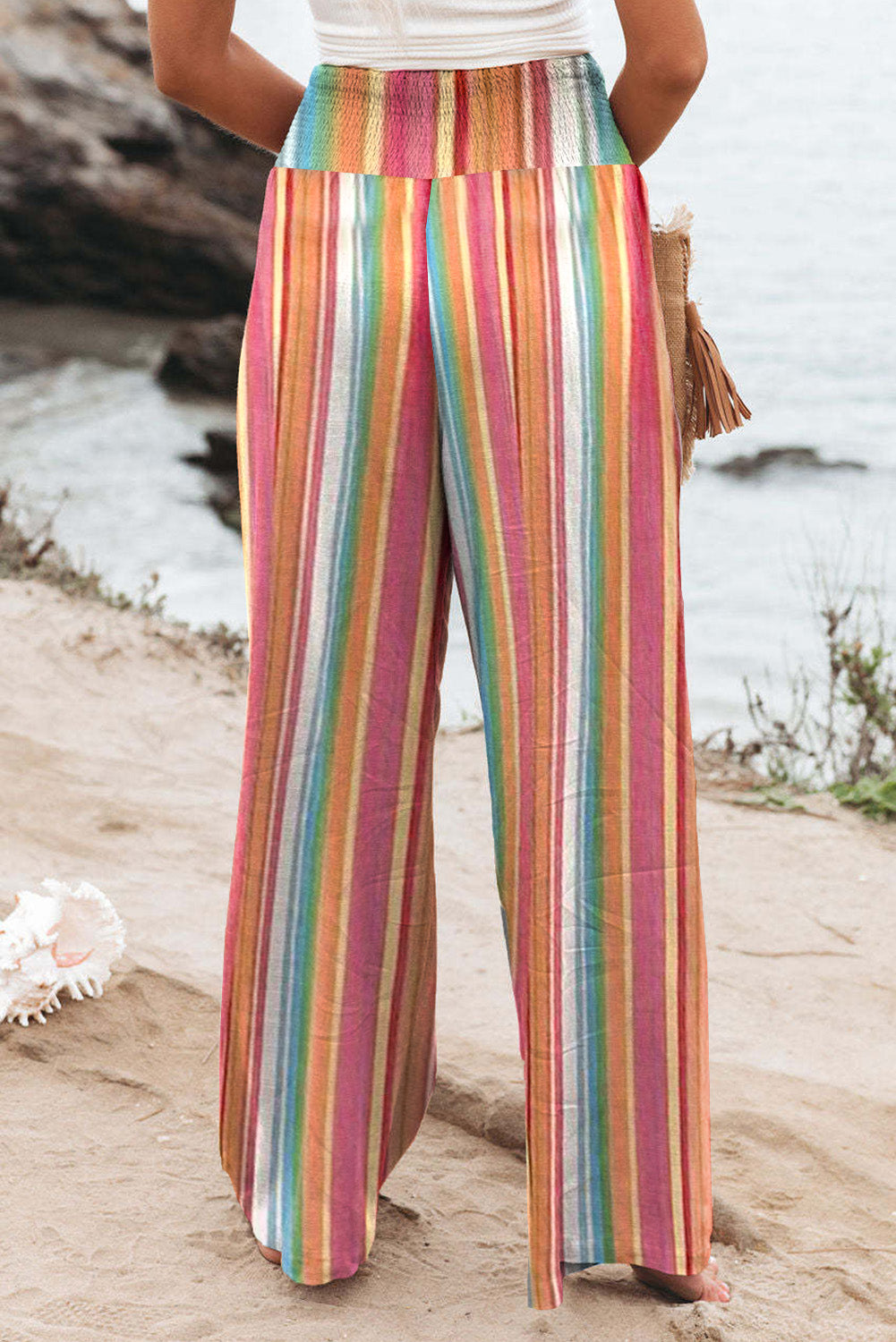 Multicolor Striped Smocked High Waisted Wide Leg Beach PantsMaterial:100%Polyester



		Made of lightweight and breathable fabric perfect for the beach or summer days.
	
	
		Features a smocked high waist design for a fla