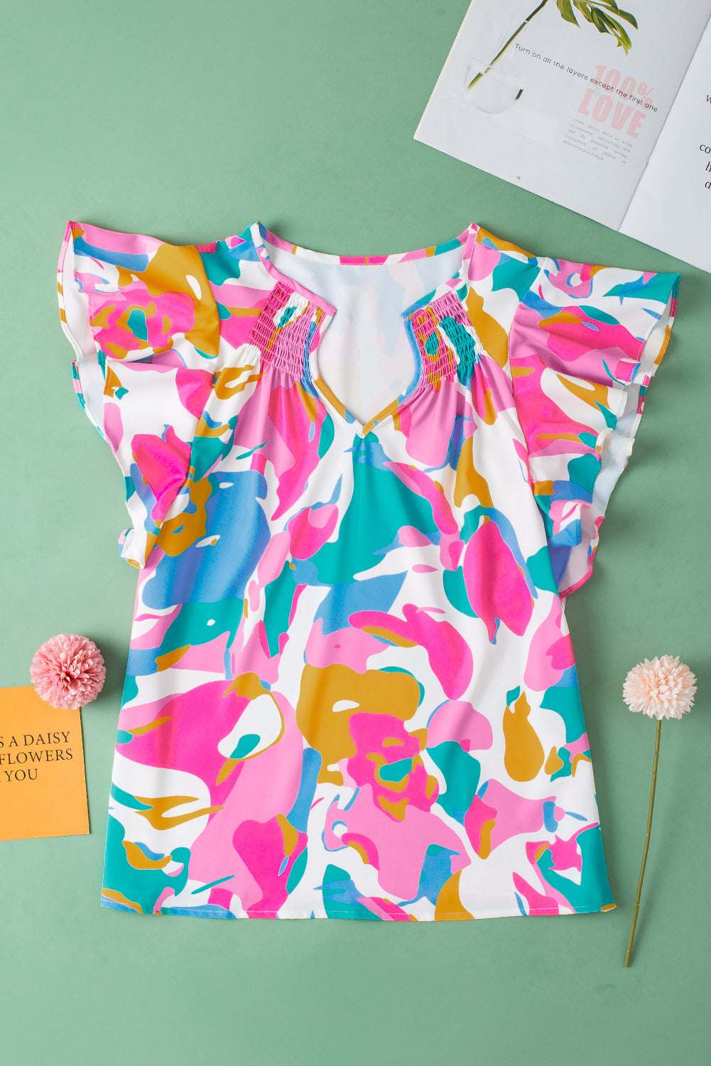 Green Abstract Print Smocked Notched Neck Ruffle Sleeve BlouseMaterial:100%Polyester

• Embrace a bohemian spirit with the blouse, featuring a vibrant green hue that adds a pop of color to any outfit.
• The abstract print des