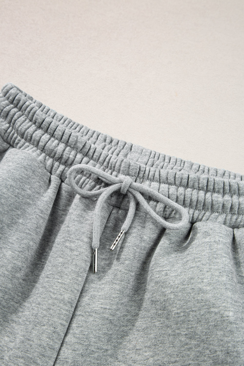 Light Grey Solid Color Side Striped Sweatshirt Pants SetMaterial:50%Polyester+50%Cotton

• This pants set exudes a modern appeal perfect for casual outings or lounging at home.
• Crafted from high-quality fabric for a s