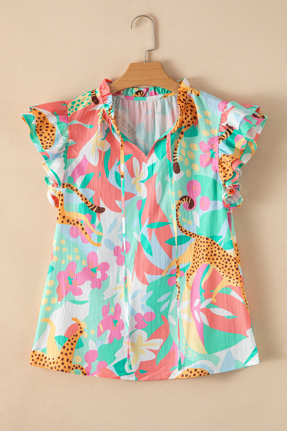 Green Tie Split Neck Ruffle Summer Cheetah Floral BlouseMaterial:100%Polyester

• Embrace the wild side of fashion with this blouse that effortlessly combines leopard print and floral patterns for a bold statement piece.