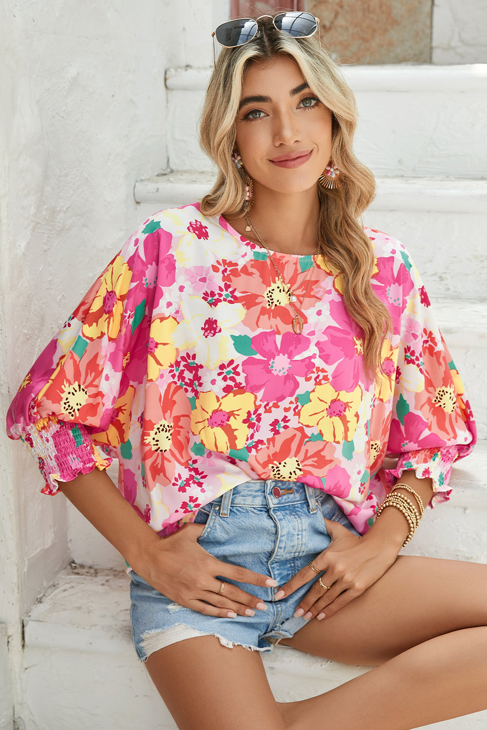Pink Shirred Cuffs 3/4 Sleeve Boho Floral BlouseMaterial:100%Polyester



		The blouse is a stylish and feminine top featuring shirred cuffs and a boho-inspired floral print, adding a touch of bohemian charm to 