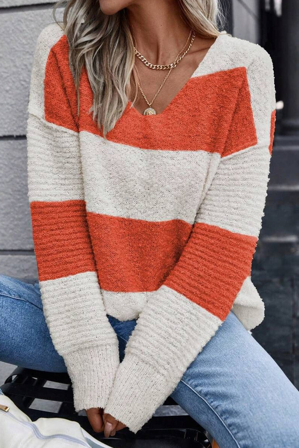 Orange Colorblock V Neck Side Slits SweaterMaterial:100%Acrylic

• Stand out in style with our sweater, blending casual stripes with a trendy rib-knit design.
• The vibrant orange hues add a pop of color to