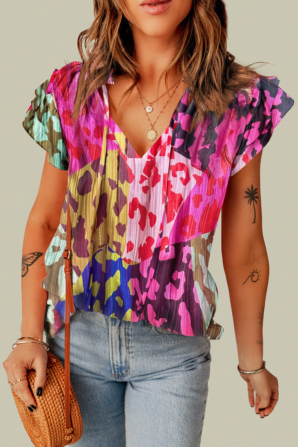 Multicolour Leopard Flutter Sleeve V Neck Crinkled BlouseMaterial:100%Polyester

• Stand out in style with this blouse, perfect for adding a touch of wild elegance to your wardrobe.
• The vibrant multicolored leopard pri