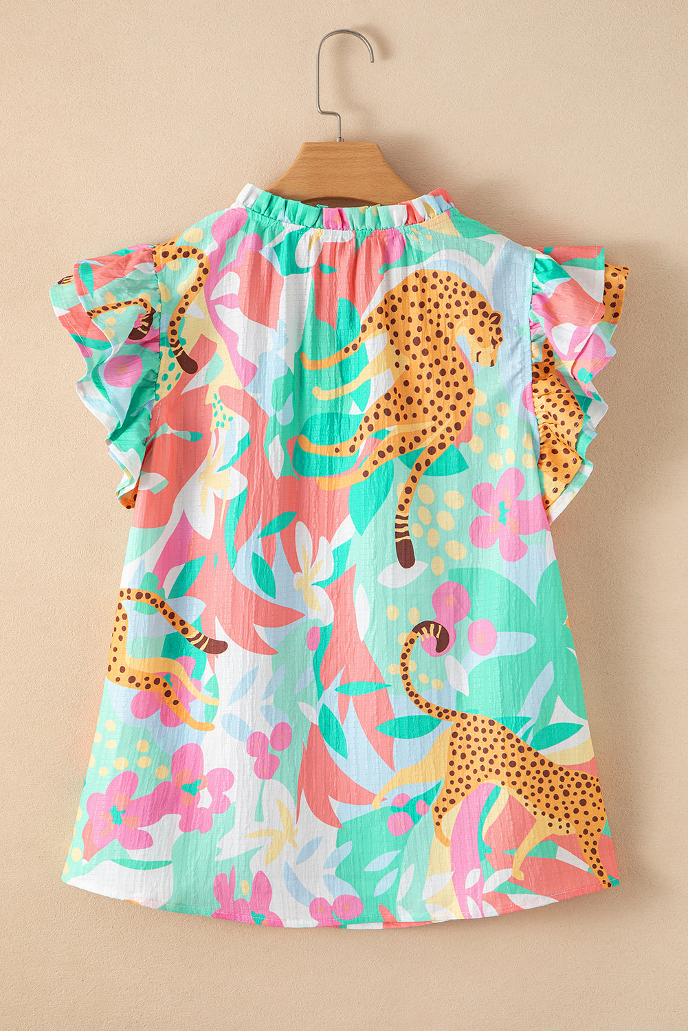 Green Tie Split Neck Ruffle Summer Cheetah Floral BlouseMaterial:100%Polyester

• Embrace the wild side of fashion with this blouse that effortlessly combines leopard print and floral patterns for a bold statement piece.